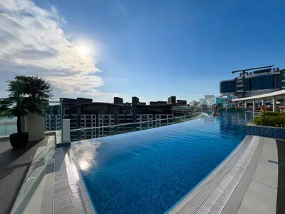 a large swimming pool on the roof of a building at Luxurious Sea-View Studio in Seven Palm - 20AB8 in Dubai