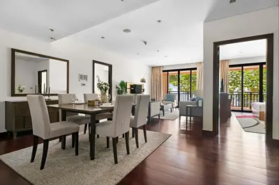 a dining room and living room with a table and chairs at StoneTree - Luxury 2 BR - Beach Access in Dubai