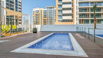 a swimming pool in the middle of a building at Frank Porter - Riviera 27 in Dubai