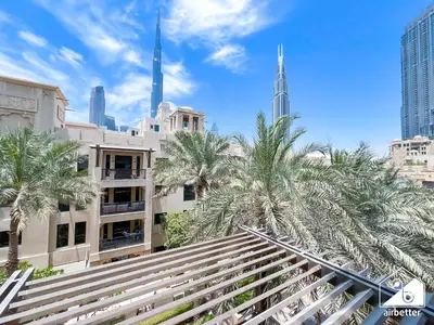 a view from the top of a building with palm trees at Luxury 2Bedroom with Terrace & Burj Khalifa view in Dubai