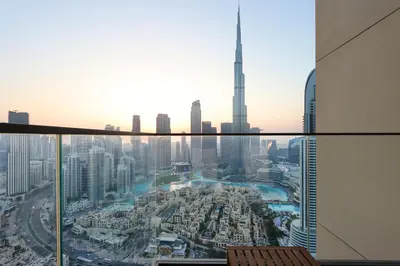 a view of a city from the top of a skyscraper at Livbnb - 3BR Deluxe suite w/ Burj Khalifa & Fountain Views in Dubai