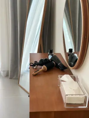 a wooden table with a mirror and a camera on it at VIP Experience Dubai Downtown at Forte Tower - Burj Khalifa and Fountain View - Modern Luxury Apartments in Dubai