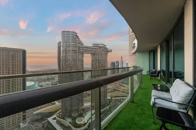a balcony with a view of a city skyline at Luxe 2BR Burj Vista Retreat, Steps from Dubai Mall & Burj Khalifa in Dubai