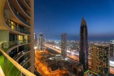 a view of a city at night from a building at Luxe 2BR Burj Vista Retreat, Steps from Dubai Mall & Burj Khalifa in Dubai