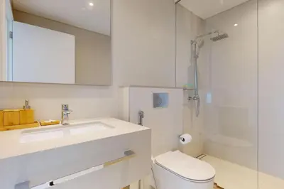 a bathroom with a sink and a toilet and a shower at La Vie JBR - Breathtaking Two Bedroom in Dubai