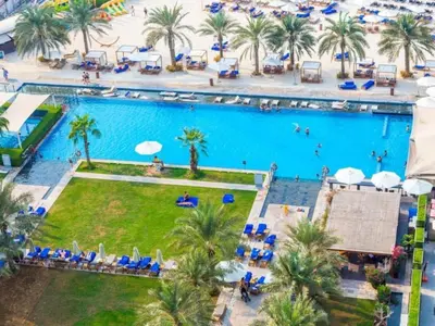 an overhead view of a swimming pool at a resort at 1BR Apartment, Full Sea and JBR View in Dubai