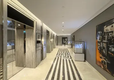 a hallway of a building with paintings on the walls at Spectacular views on high floor with Infinity Pool in Dubai