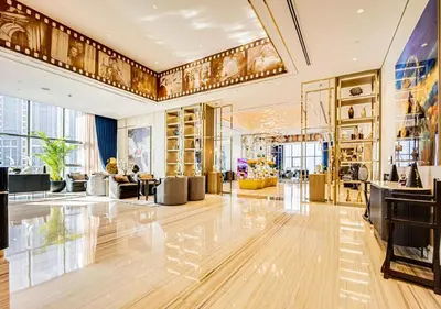 a large room with a lobby with a lot of furniture at Spectacular views on high floor with Infinity Pool in Dubai