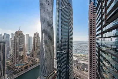 an aerial view of a city with tall buildings at Luxury 2BR with Marina Views Near Dining Shopping Attractions & Beaches in Dubai