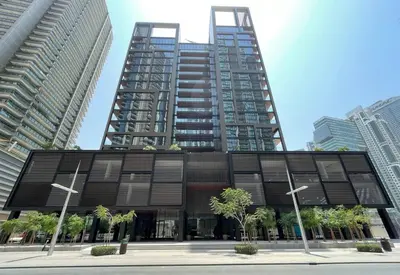 a large building with two tall buildings in a city at FIRST CLASS Studio Stylish Urban Escape in Dubai