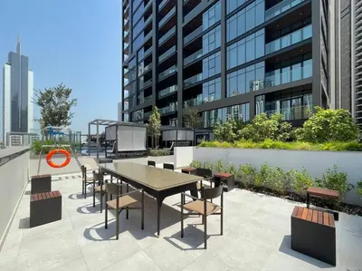 a table and chairs on top of a building at FIRST CLASS Studio Stylish Urban Escape in Dubai