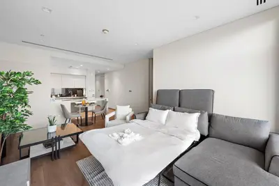 a living room with a couch and a table at FIRST CLASS 1BR Stunning Burj Khalifa Views in Dubai