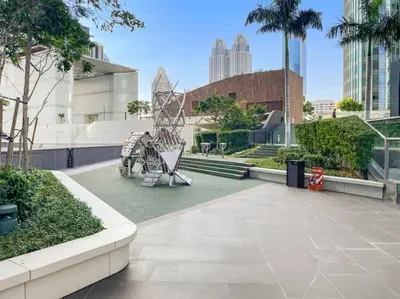 a park with a playground with a slide at FIRST CLASS 1BR Stunning Burj Khalifa Views in Dubai