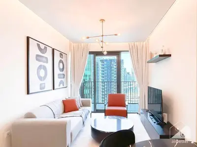a living room with a couch and a table at Luxurious 1Bedroom Balcony & View Business bay in Dubai