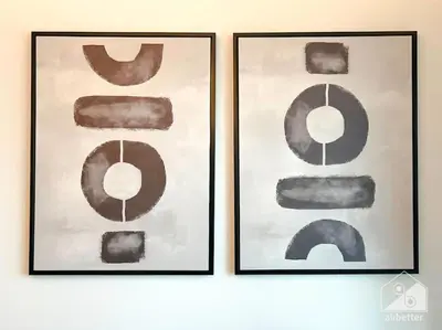 two framed art prints on a wall at Luxurious 1Bedroom Balcony & View Business bay in Dubai