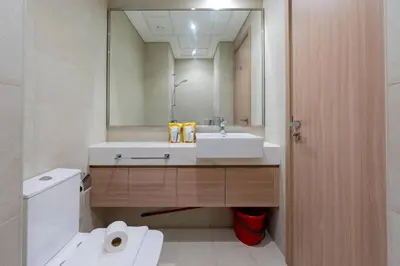 a bathroom with a sink and a mirror at 12 min from downtown - Studio - Azizi Riviera in Dubai