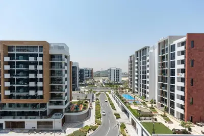 an aerial view of a city with tall buildings at Studio - 12 min downtown - Pool - Azizi Riviera in Dubai