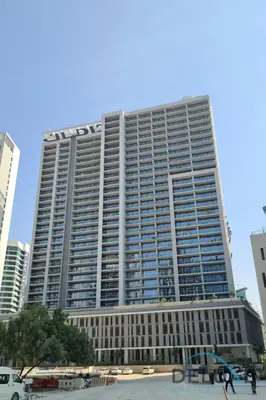 a large building in the middle of a city at Calm 1BR in Vera Tower, Business Bay by Deluxe Holiday Homes in Dubai