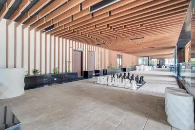 a large room with a group of chessetts on the floor at Comfy Studio in Business Bay l Stays 2 in Dubai