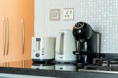 a coffee maker on a counter in a kitchen at Comfy Studio in Business Bay l Stays 2 in Dubai
