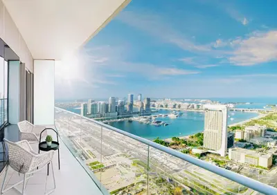 a balcony with a view of the ocean and buildings at Luxe Sea View High Floor 1 BR in Dubai Marina by Maxx Value Homes in Dubai