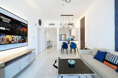 a living room with a large flat screen tv at Luxe Sea View High Floor 1 BR in Dubai Marina by Maxx Value Homes in Dubai