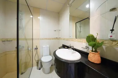 a bathroom with a sink and a toilet and a shower at Lux 2BD apartment, Steps to the Beach in the Heart of Dubai Marina - Elite Residence Tower in Dubai