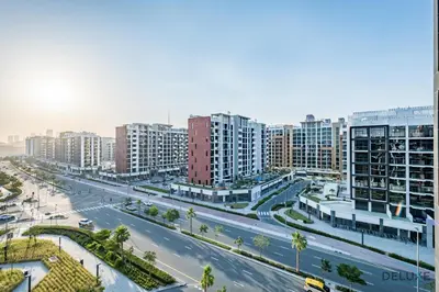 an aerial view of a city with tall buildings at Appealing Studio Apartment at Azizi Riviera 34, Al Merkadh by Deluxe Holiday Homes in Dubai