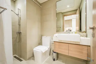 a bathroom with a toilet and a sink and a shower at Appealing Studio Apartment at Azizi Riviera 34, Al Merkadh by Deluxe Holiday Homes in Dubai