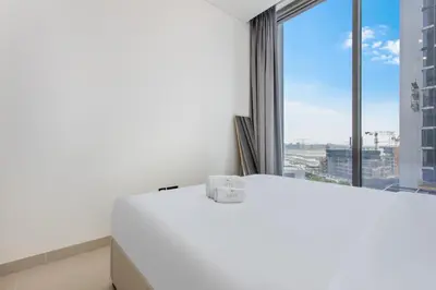 a white desk in a room with a large window at STAY BY LATINEM Luxury 1BR Holiday Home CVR A609 near Burj Khalifa in Dubai