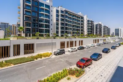 a parking lot with cars parked in front of buildings at GuestReady - Downtown Dubai luxurious living in Dubai