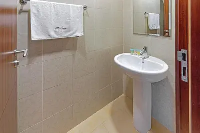 a bathroom with a sink and a mirror at City skyline view I Super-fast Wi-fi I Downtown in Dubai