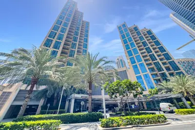 a city with palm trees and tall buildings at City skyline view I Super-fast Wi-fi I Downtown in Dubai
