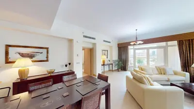 a living room with a couch and a table at Dabas Palm Shores Elegant Four Beds in Dubai