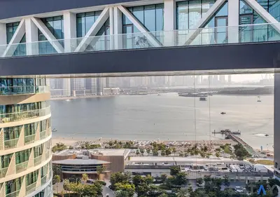 a bridge over a body of water in a building at Luxurious 1BR Palm Seven, Palm Jumeirah in Dubai