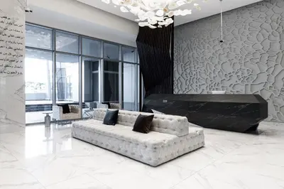 a living room with a couch and a fireplace at GLOBALSTAY J One Tower Apartments at Pearl of UAE in Dubai