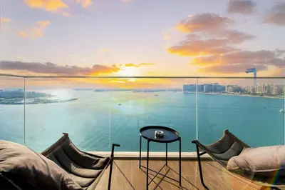 a room with a view of the water at SettlerHomes - Breathtaking View With Private Beach in Dubai