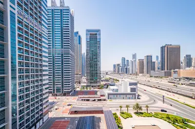 an aerial view of a city with tall buildings at Unbeatable Price, Luxury 1BR, Limited Time Offer by Deluxe Holiday Homes in Dubai