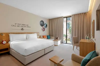 a bedroom with a bed and a living room at Rove JBR in Dubai