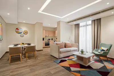 a living room with a couch and a table at Rove JBR in Dubai