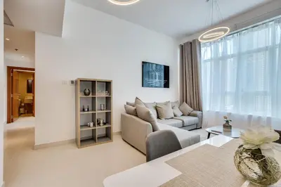 a living room with a couch and a table at Stylish 2bd with great view in Marina View Tower in Dubai