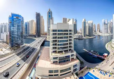a view of a city with a river and buildings at Stylish 2bd with great view in Marina View Tower in Dubai