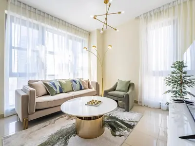 a living room with a couch and a table at Downtown Luxury Living -1BR-Standpoint Tower A in Dubai
