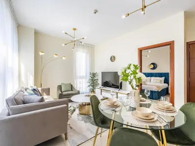 a living room with a table and chairs at Downtown Luxury Living -1BR-Standpoint Tower A in Dubai