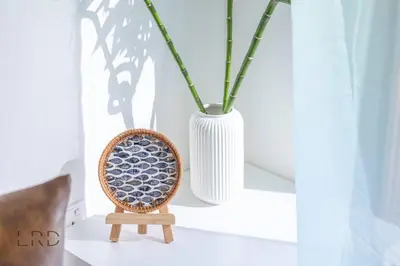 a white vase sitting on a shelf next to a chair at Modern & Vibrant 1BR Dubai Hills in Dubai