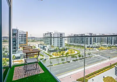 a view of a city with tall buildings and a street at Zapbed House - Modern Studio in Azizi Riviera 27 Meydan One in Dubai