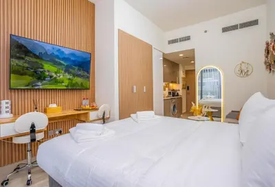 a bedroom with a large white bed in a room at Zapbed House - Modern Studio in Azizi Riviera 27 Meydan One in Dubai