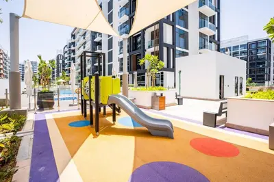 a playground with a slide in a building at Zapbed House - Modern Studio in Azizi Riviera 27 Meydan One in Dubai