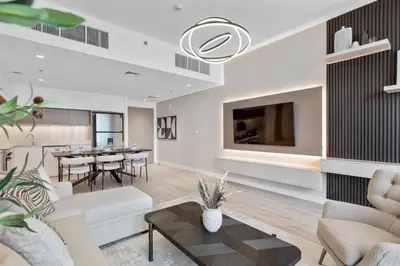 a living room with a couch and a table at Luxury 2 bedroom in Dubai Creek Harbour- Suiteable in Dubai