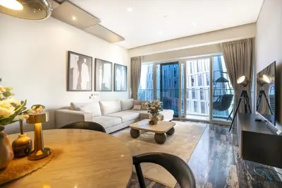 a living room with a table and a couch at Charming 1BR in Damac Heights, Dubai Marina by Deluxe Holiday Homes in Dubai